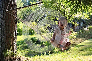 Little girl in hammock nature summer