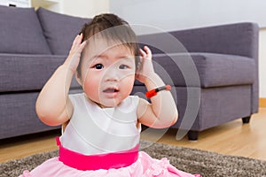 Little girl hand cover ear
