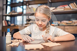 Little girl handcrafting