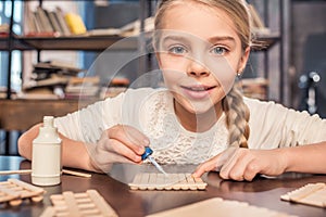 Little girl handcrafting
