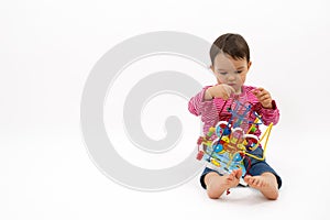 Little girl happy with colorful wooden Toys isolated on white background