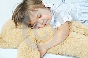 Little girl happy sleeping smiley with Teddy bear