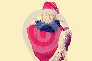 Little girl in a hat Santa Claus on white background.