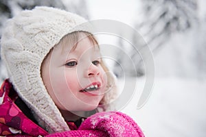 Little girl have fun at snowy winter day