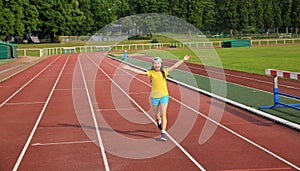 Little girl have fun on the stadium