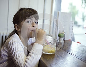 Little girl having breakfast