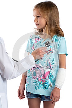 Little girl having cardiovascular auscultation check up