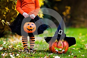 Little girl having fun on Halloween trick or treat photo