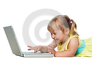 Little girl having fun on laptop.