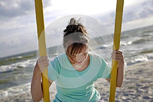 Little girl having fun on the swing