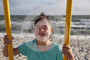 Little girl having fun on the swing