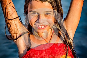 Little girl having fun in the water in Ada bojana, Montenegro