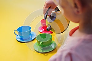 Little girl having a tea party