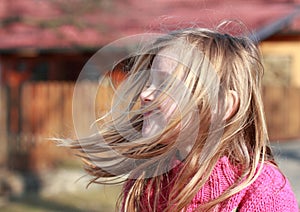 Little girl with hears flying in the wind photo