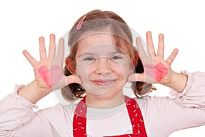 Little girl with hearts on hands