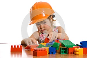 Little girl in a helmet plays photo