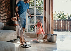 Little girl help her daddy to do chores