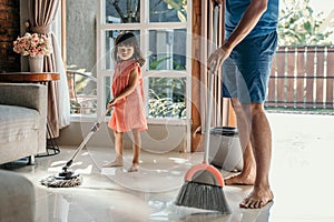 Little girl help her daddy to do chores