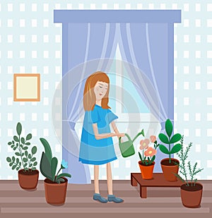 Little girl helps with housework. watering from a watering can indoor plants in pots