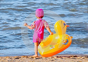 Little girl with her cute swim ring