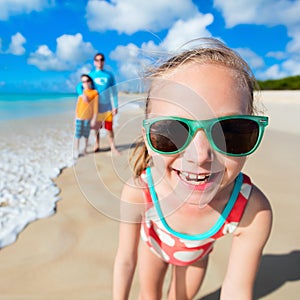 Little girl and her family at beach