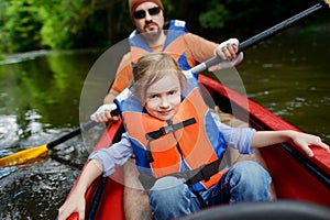 Little girl and her father on a kayak