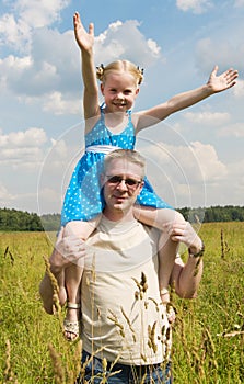 Little girl on her fathers shoulders