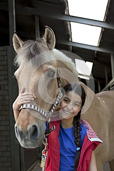 Little girl with her favorite horse photo
