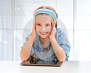 Little girl and her magic tablet