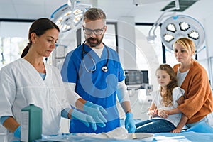 Little girl with her mother in surgery examination.