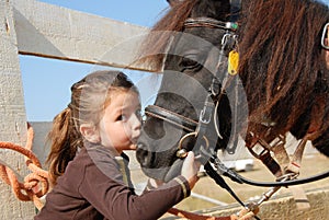 Little girl and her pony