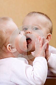 Little girl and her reflexion photo