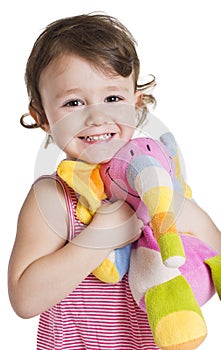 Little girl with her toy elephant