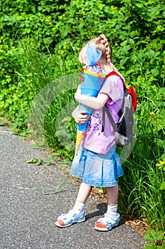 Little girl on her way to her first day of school