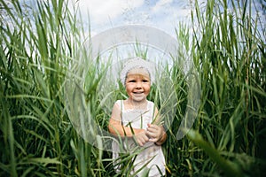 Little girl in high grass