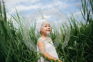 Little girl in high grass