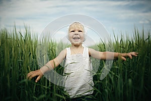 Little girl in high grass