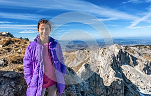 Little girl hiking on the Mountains in National Park Durmitor, M