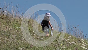 Little girl hiking in the nature