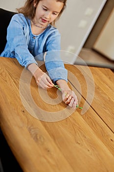 Little girl hold in hand microgreen, healthy food concept