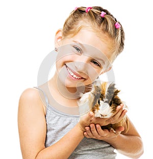 Little girl holding a guinea pig