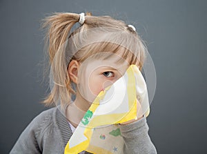 Little girl holding handkerchief