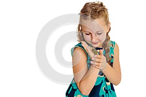 Little girl holding in hands a small turtle.
