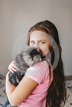 Little girl holding her new pet