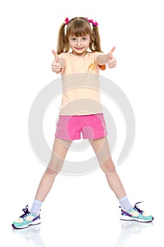 Little girl holding her thumb up