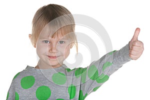 Little girl holding her thumb up