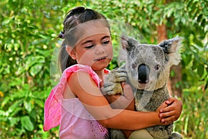 Little girl holding a Koala