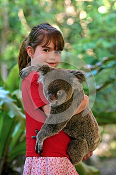 Little girl holding a Koala