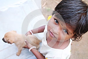 Little Girl Holding Little Dog