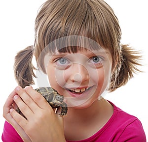 little girl holding a pet turtle